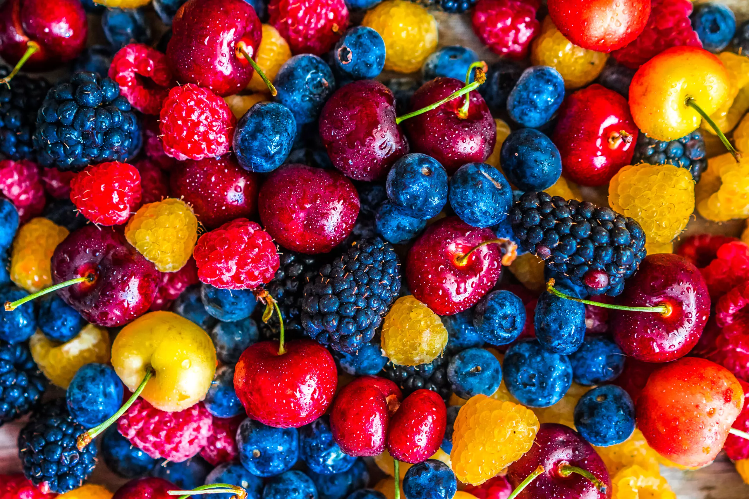 Assorted fresh colorful berries close-up.